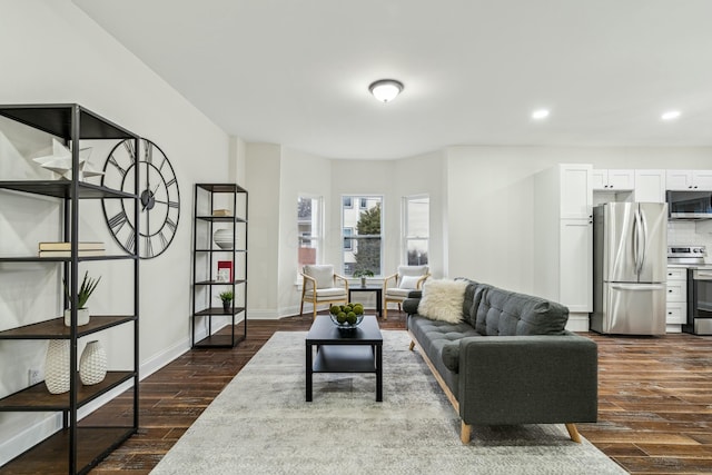 living room featuring recessed lighting, dark wood finished floors, and baseboards