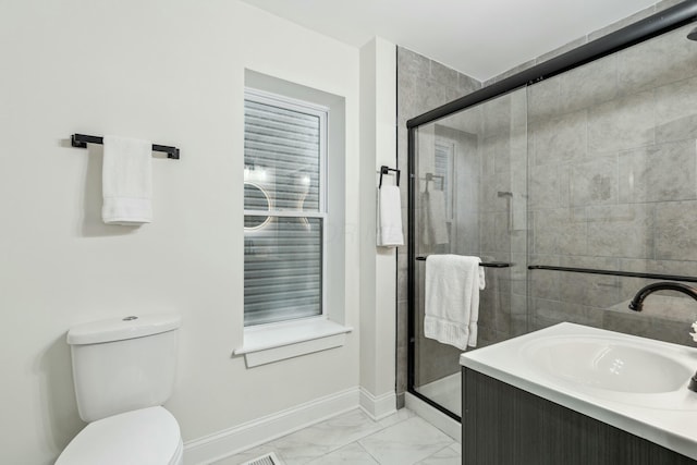 bathroom featuring marble finish floor, a shower stall, toilet, and baseboards