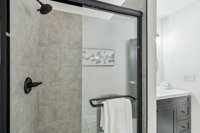 full bath featuring a stall shower and vanity