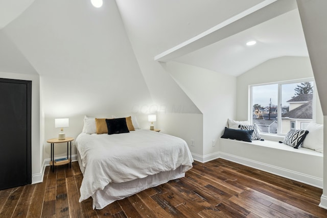 bedroom with wood-type flooring, vaulted ceiling, and baseboards