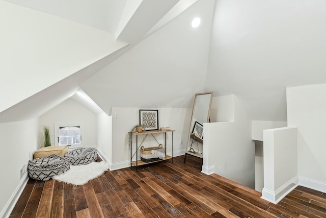 bonus room featuring vaulted ceiling, wood finished floors, visible vents, and baseboards