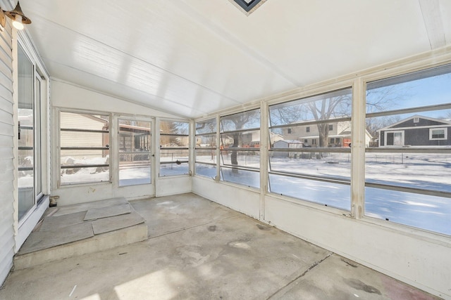 unfurnished sunroom with lofted ceiling