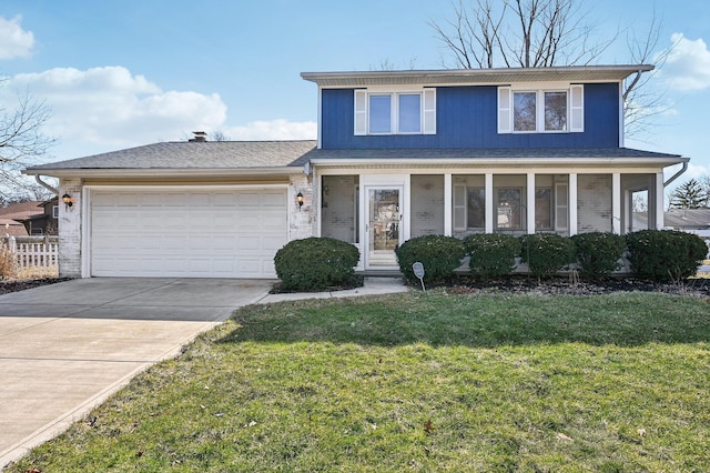 traditional-style home featuring a garage, brick siding, fence, driveway, and a front yard