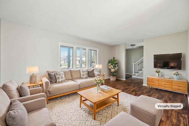 living area with stairs, wood finished floors, and baseboards