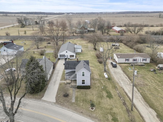 birds eye view of property with a rural view