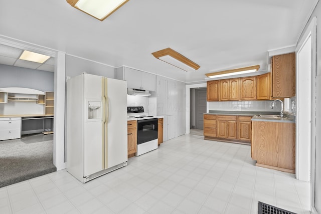 kitchen with white refrigerator with ice dispenser, decorative backsplash, electric range oven, a sink, and ventilation hood