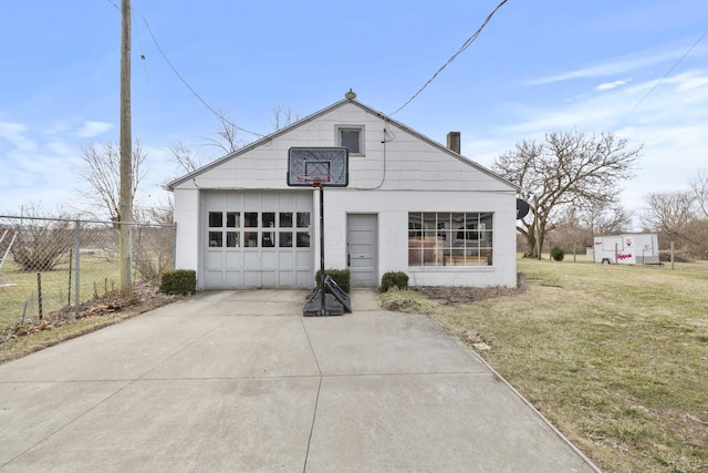 view of front of house with an outdoor structure, fence, driveway, a front lawn, and a chimney