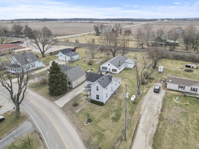 birds eye view of property with a rural view