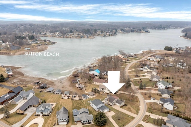 aerial view with a residential view and a water view