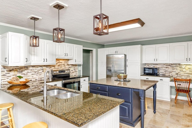 kitchen featuring stainless steel appliances, white cabinetry, a sink, blue cabinets, and a kitchen breakfast bar