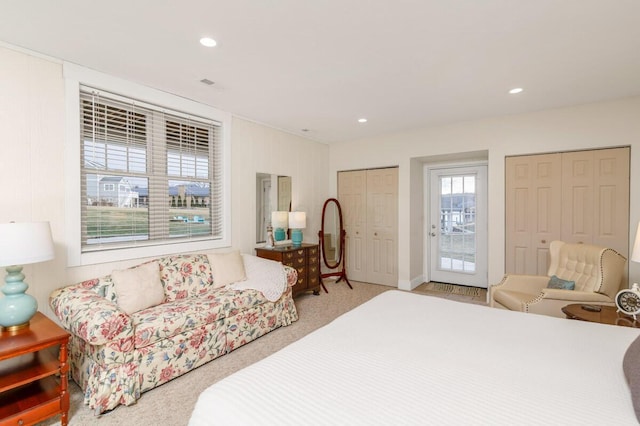 carpeted bedroom with access to exterior, multiple closets, and recessed lighting