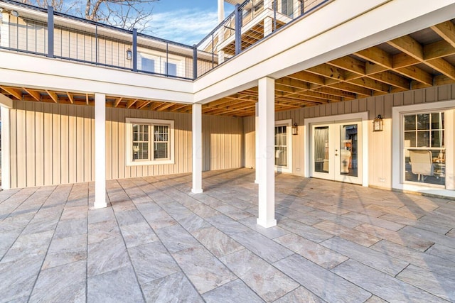 view of patio / terrace featuring a balcony and french doors