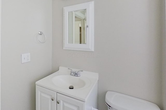 half bath with toilet and vanity