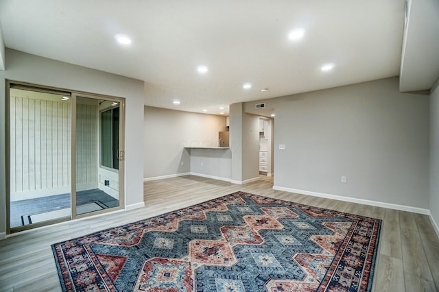 interior space with visible vents, light wood-style flooring, recessed lighting, and baseboards