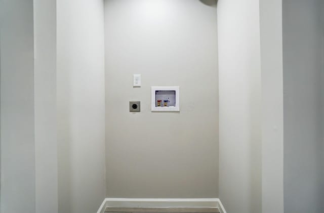 laundry room with baseboards, hookup for an electric dryer, hookup for a washing machine, and laundry area