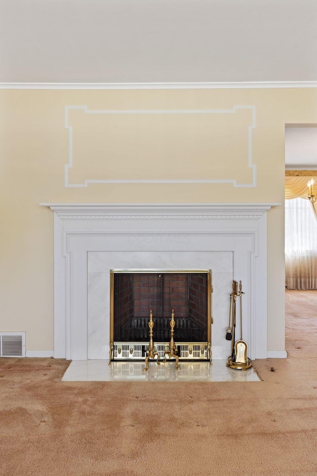 interior details with ornamental molding, carpet, a fireplace with flush hearth, and visible vents