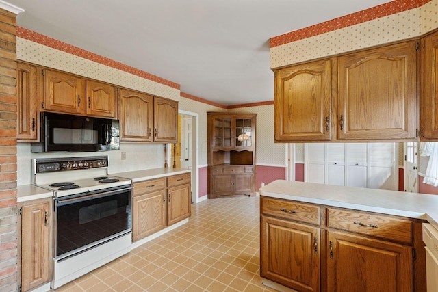 kitchen with wallpapered walls, white electric stove, brown cabinets, light countertops, and black microwave