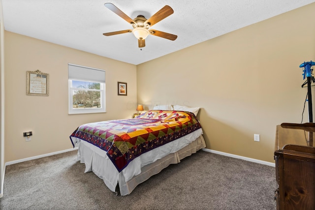 carpeted bedroom featuring ceiling fan, a textured ceiling, and baseboards