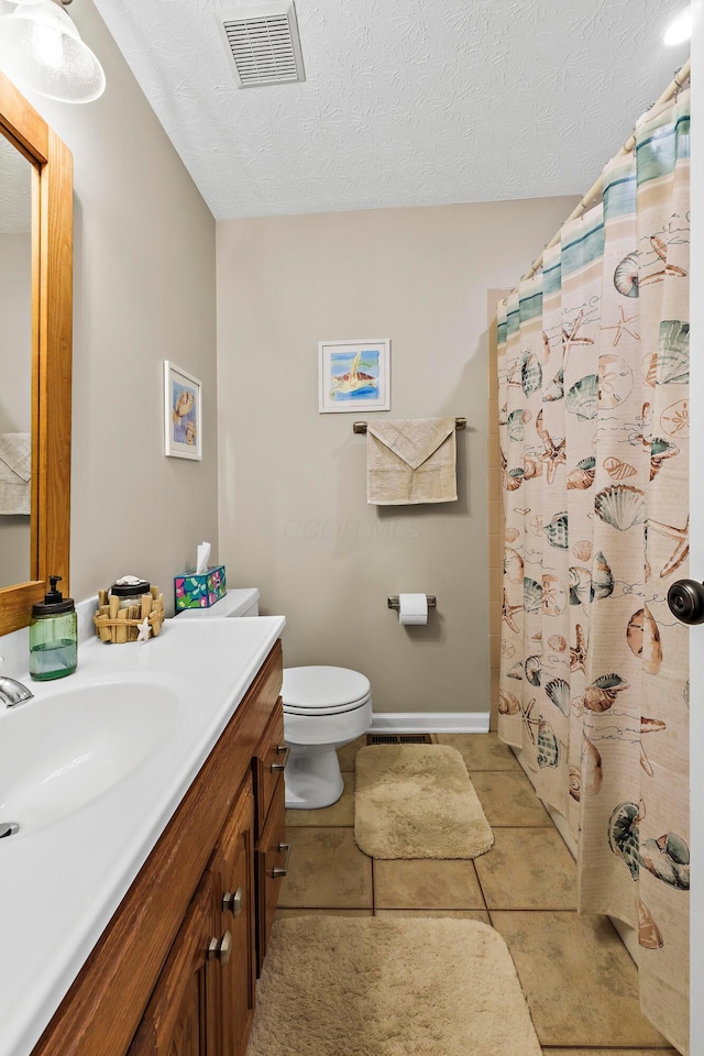 full bathroom featuring visible vents, a textured ceiling, toilet, and vanity