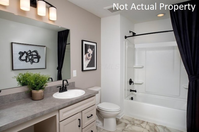 bathroom with toilet, visible vents, vanity, marble finish floor, and washtub / shower combination