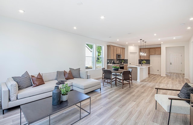603 Mill Stone Dr Lot 2257, Sunbury, OH 43074 - living area featuring light wood-type flooring, baseboards, and recessed lighting