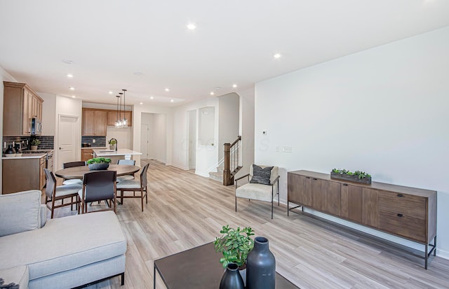 603 Mill Stone Dr Lot 2257, Sunbury, OH 43074 - living area featuring light wood-style flooring, stairs, recessed lighting, and baseboards