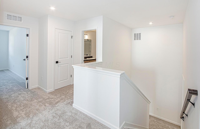 603 Mill Stone Dr Lot 2257, Sunbury, OH 43074 - hallway featuring an upstairs landing, light carpet, recessed lighting, and baseboards