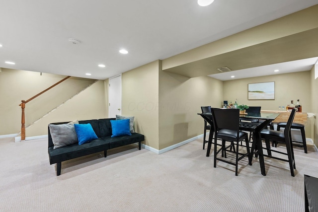 carpeted dining area with recessed lighting, visible vents, baseboards, and stairway