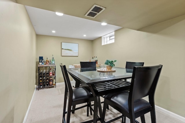 dining area with recessed lighting, visible vents, baseboards, and light colored carpet