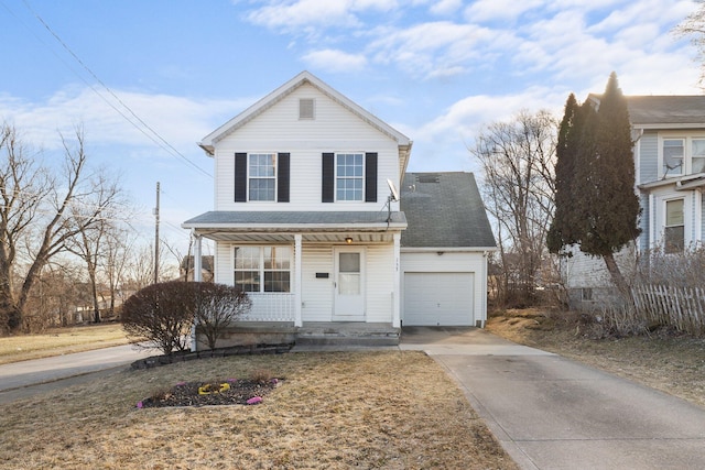 traditional-style house featuring a garage, a porch, concrete driveway, and roof with shingles