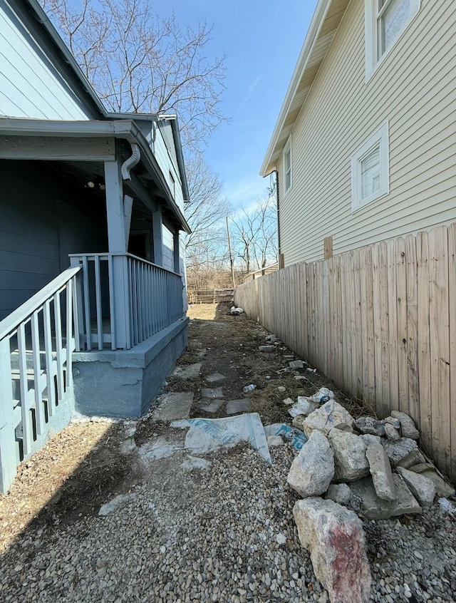 view of side of property with fence