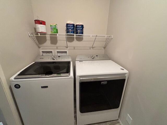 laundry room with separate washer and dryer