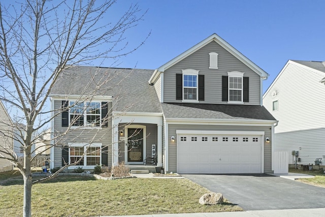 view of front facade with aphalt driveway, a garage, a front yard, and a shingled roof