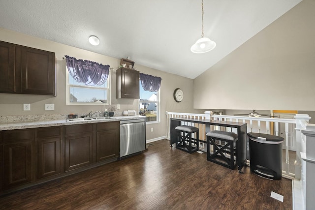 kitchen with dark brown cabinetry, dark wood finished floors, dishwasher, vaulted ceiling, and a sink