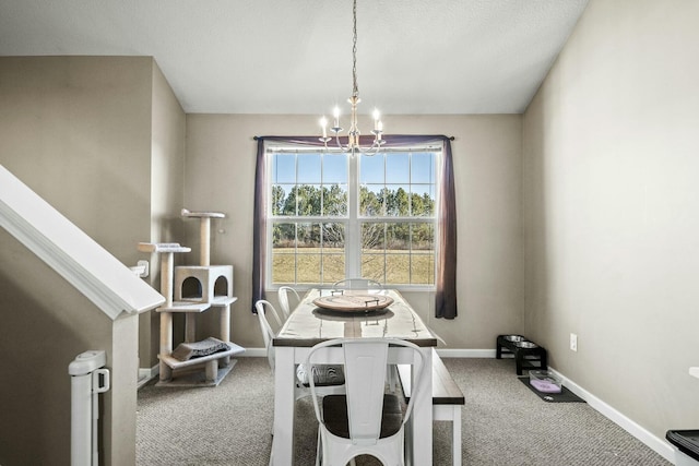 carpeted dining space featuring stairway, baseboards, and a chandelier