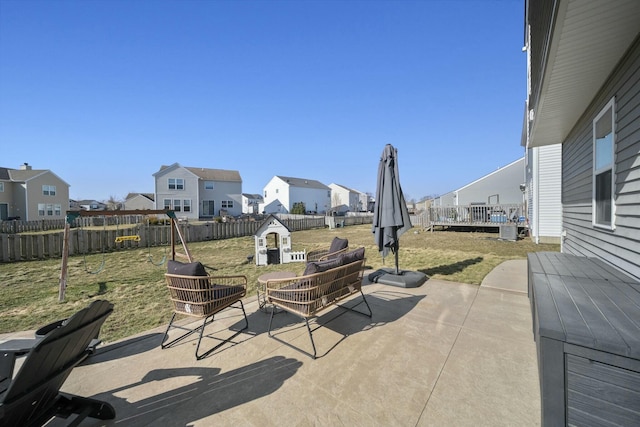 view of patio / terrace with a residential view and a fenced backyard