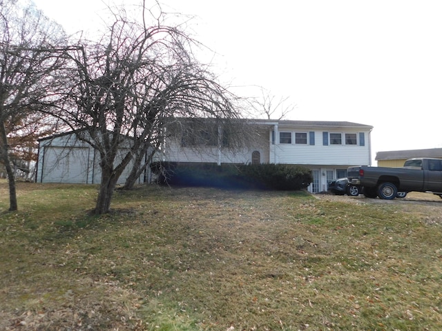 view of front facade with a garage and a front lawn