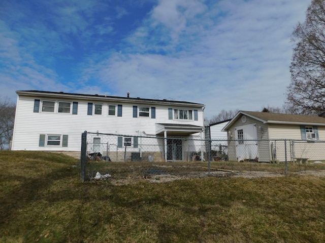 view of front of home with fence and a front lawn