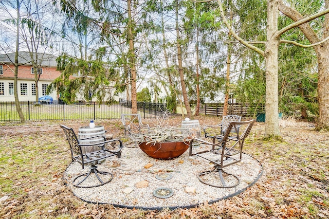 view of patio / terrace featuring a fire pit and fence