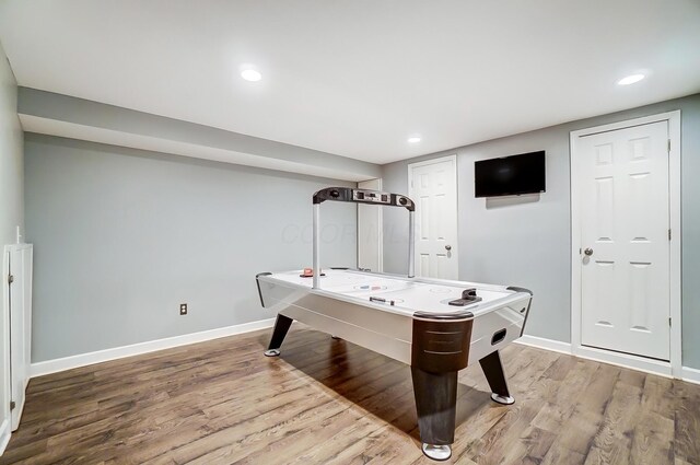 game room with recessed lighting, light wood-type flooring, and baseboards