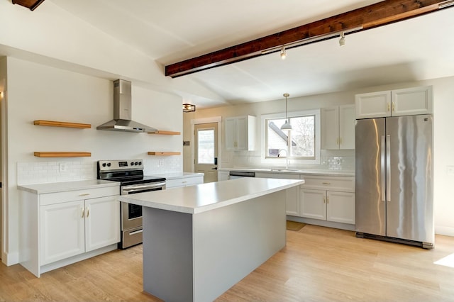 kitchen featuring open shelves, light countertops, stainless steel appliances, wall chimney exhaust hood, and a sink