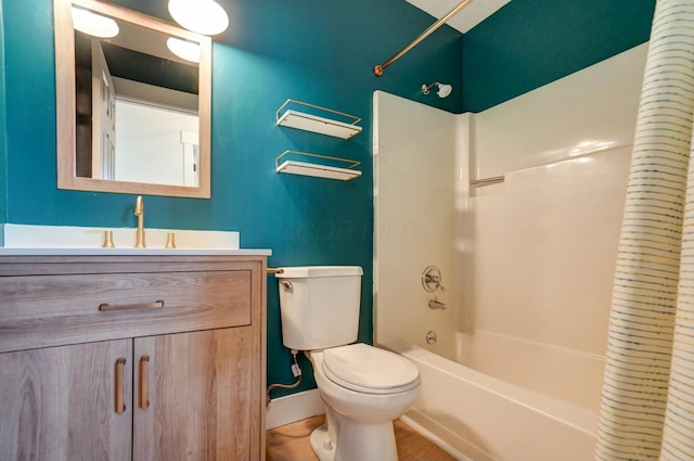 bathroom featuring vanity, shower / tub combo, and toilet