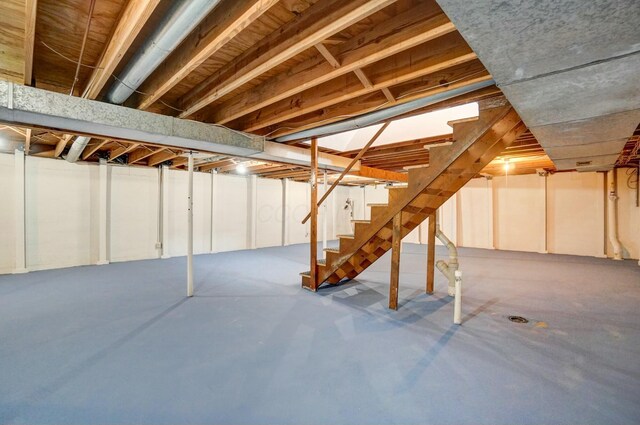 unfinished basement with stairway