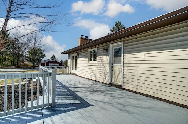 deck featuring an outdoor structure