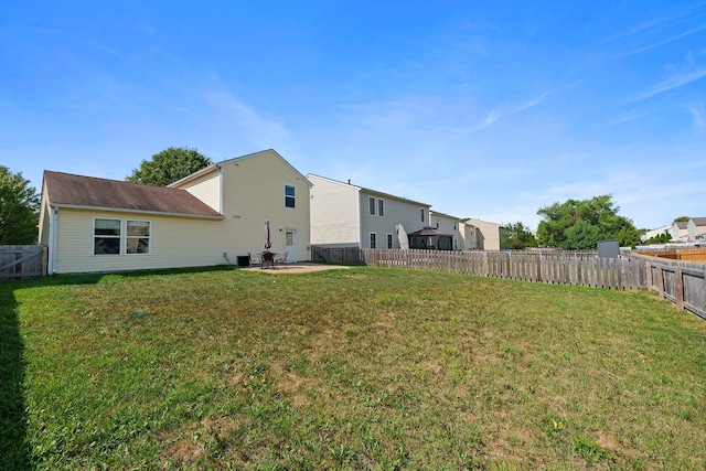 view of yard featuring a patio area and a fenced backyard