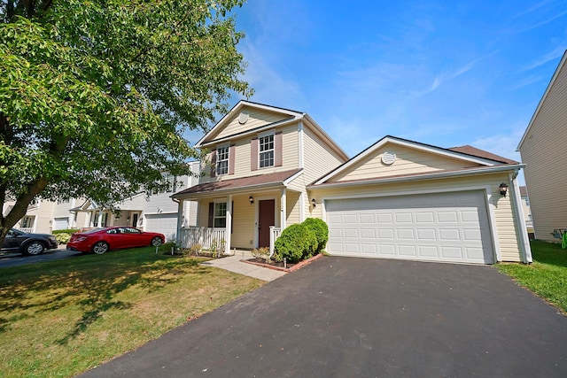 traditional home with an attached garage, driveway, a porch, and a front yard