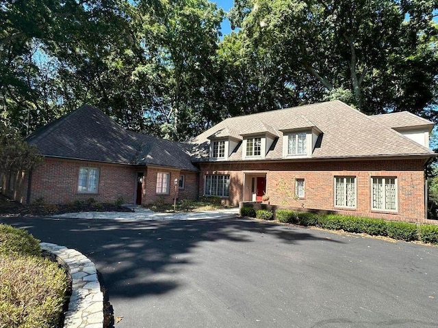 view of front of home featuring brick siding