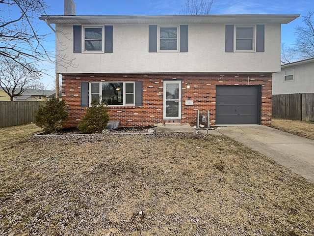 view of front of home with driveway, a chimney, an attached garage, fence, and brick siding