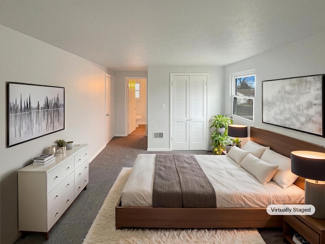 bedroom with baseboards, carpet, visible vents, and a closet