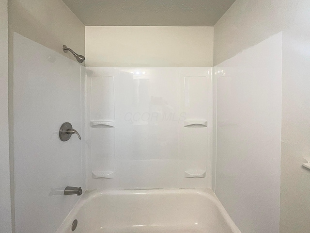 full bathroom featuring  shower combination